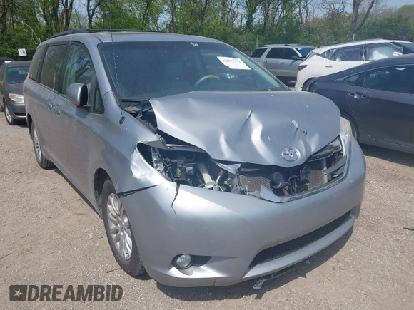 2014 Toyota Sienna XLE with VIN 5TDYK3DC9ES413283, listed as a IAAI auction lot 42091379 with 184,506 mi miles and . Bid and sale history available at DreamBid. Image 6.