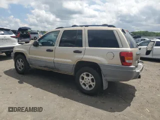1999 Jeep Grand Cherokee Laredo with VIN 1J4GW58N7XC799434, listed as a Copart auction lot 64790905 with 272,384 mi miles and Salvage title. Bid and sale history available at DreamBid. Image 2.