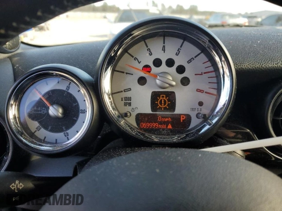 2011 MINI Convertible with VIN WMWZN3C53BT133576, listed as a Copart auction lot 87543835 with 69,999 mi miles and Salvage title. Bid and sale history available at DreamBid. Image 9.