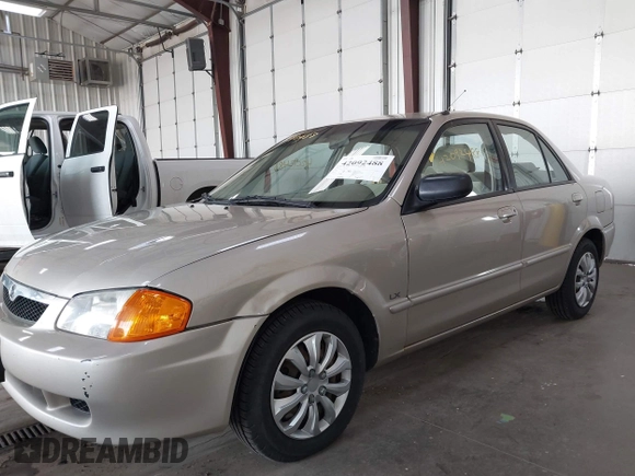 2000 Mazda Protege DX with VIN JM1BJ2221Y0239987, listed as a IAAI auction lot 42092488 with 140,756 mi miles and . Bid and sale history available at DreamBid. Image 6.