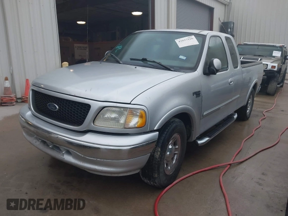 2003 Ford F-150 XL with VIN 2FTRX17223CA73626, listed as a IAAI auction lot 42027926 with 127,614 mi miles. Bid and sale history available at carsss.com. Image 2.