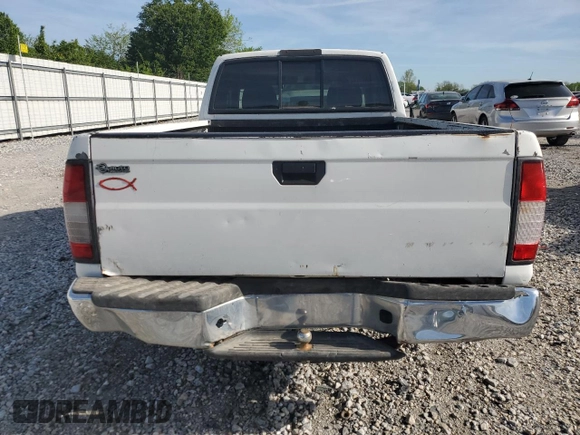 1999 Nissan Frontier XE with VIN 1N6DD26S4XC319806, listed as a Copart auction lot 54233635 with 311,759 mi miles and Clean title. Bid and sale history available at DreamBid. Image 6.