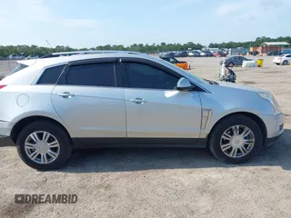 2014 Cadillac SRX Luxury Collection z VIN 3GYFNEE36ES652353, wystawiony jako IAAI lot #42233986 z przebiegiem 146 029 mil mil oraz . Historia ofert i sprzedaży dostępna na DreamBid. Obrazek 13.