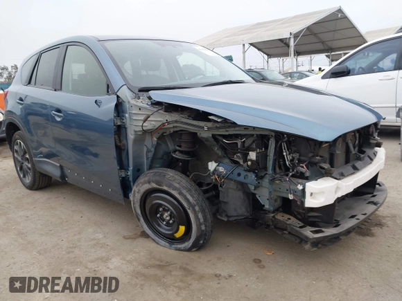 2016 Mazda CX-5 Grand Touring with VIN JM3KE2DY7G0875678, listed as a IAAI auction lot 42104888 with 30,566 mi miles. Bid and sale history available at carsss.com. Image 1.