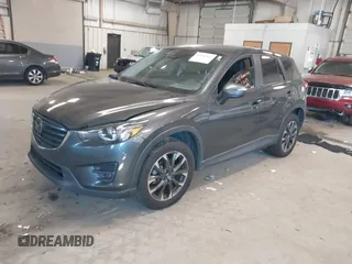 2016 Mazda CX-5 Grand Touring with VIN JM3KE2DYXG0846787, listed as a IAAI auction lot 41346364 with 113,553 mi miles. Bid and sale history available at carsss.com. Image 17.