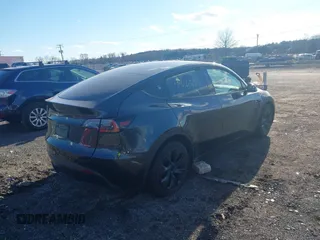 2024 Tesla Model Y Long Range with VIN 7SAYGAEEXRF212415, listed as a IAAI auction lot 41665627 with Not Provided miles and . Bid and sale history available at DreamBid. Image 4.