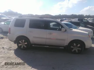2012 Honda Pilot Touring with VIN 5FNYF3H92CB027292, listed as a IAAI auction lot 40617936 with 140,455 mi miles and . Bid and sale history available at carsss.com. Image 13.