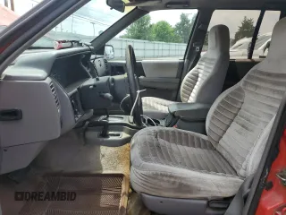 1994 Jeep Grand Cherokee Laredo с VIN 1J4GZ58S7RC311048, выставлен на аукционе Copart как лот 56759635 с пробегом 242 460 миль миль и Списание • Salvage title. История ставок и продаж доступна на DreamBid. Изображение 7.