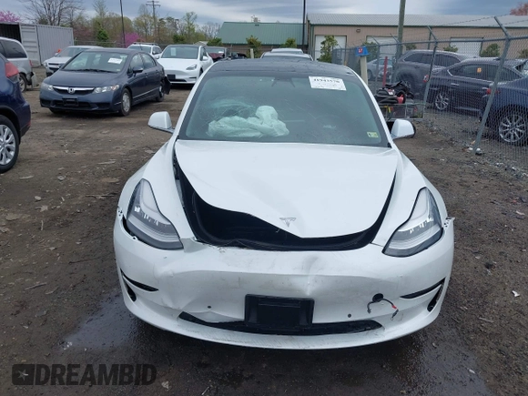 2019 Tesla Model 3 Mid Range with VIN 5YJ3E1EA5KF397098, listed as a IAAI auction lot 41943570 with 72,046 mi miles and . Bid and sale history available at DreamBid. Image 12.