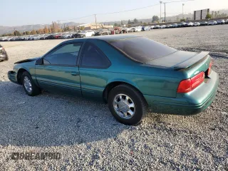 1997 Ford Thunderbird LX with VIN 1FALP62W4VH170423, listed as a Copart auction lot 83379614 with 93,117 mi miles and Salvage Title. Bid and sale history available at DreamBid. Image 2.