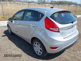 2013 Ford Fiesta SE with VIN 3FADP4EJ9DM157685, listed as a IAAI auction lot 42145511 with 101,331 mi miles. Bid and sale history available at carsss.com. Image 3.