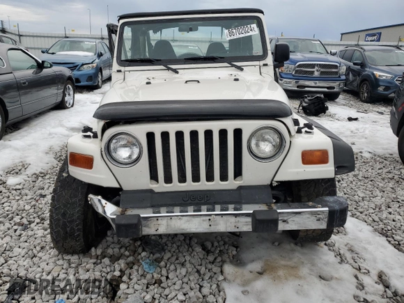 1999 Jeep Wrangler SE with VIN 1J4FY29P6XP452304, listed as a Copart auction lot 86702024 with 141,896 mi miles and Salvage Title. Bid and sale history available at carsss.com. Image 5.