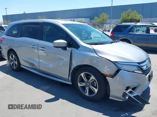 2018 Honda Odyssey Touring with VIN 5FNRL6H81JB022975, listed as a IAAI auction lot 42653304 with 210,137 mi miles and . Bid and sale history available at DreamBid. Image 1.