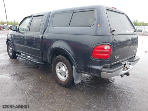 2001 Ford F-150 SuperCrew XLT with VIN 1FTRW07L41KB78053, listed as a IAAI auction lot 41965594 with 303,647 mi miles. Bid and sale history available at carsss.com. Image 3.
