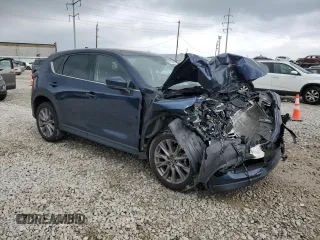 2019 Mazda CX-5 Grand Touring with VIN JM3KFBDM4K0676946, listed as a Copart auction lot 61040465 with Not provided miles and Salvage title. Bid and sale history available at DreamBid. Image 4.
