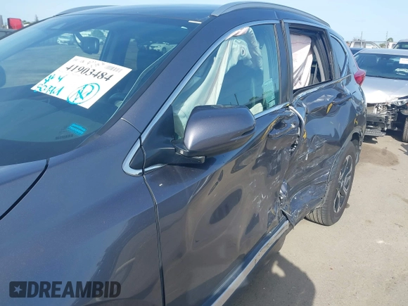 2018 Honda CR-V Touring with VIN 7FARW1H93JE027294, listed as a IAAI auction lot 41903484 with 80,999 mi miles and . Bid and sale history available at DreamBid. Image 18.