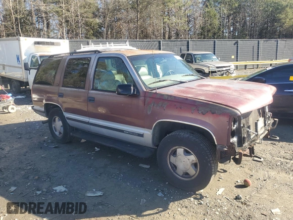 1997 GMC Yukon with VIN 1GKEK13R1VJ702558, listed as a Copart auction lot 85930054 with 165,837 mi miles and Salvage Title. Bid and sale history available at carsss.com. Image 4.