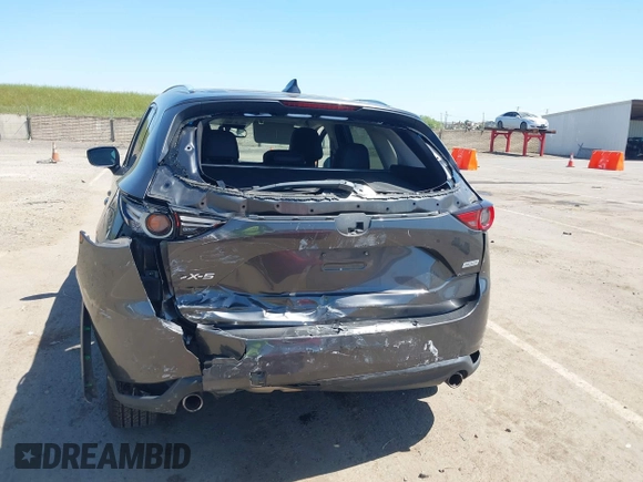 2017 Mazda CX-5 Grand Touring with VIN JM3KFADL6H0217850, listed as a IAAI auction lot 42033404 with 74,198 mi miles and . Bid and sale history available at carsss.com. Image 6.