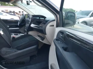 2012 Dodge Grand Caravan SXT with VIN 2C4RDGCG1CR141019, listed as a IAAI auction lot 42088541 with 148,931 mi miles and . Bid and sale history available at DreamBid. Image 5.