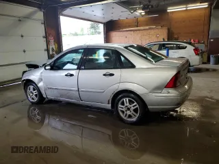 2003 Ford Focus SE z VIN 1FAFP34P43W186633, wystawiony jako Copart lot #56899065 z przebiegiem Nie podano mil oraz Szkoda całkowita • Salvage title. Historia ofert i sprzedaży dostępna na DreamBid. Obrazek 2.