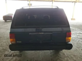 1996 Jeep Cherokee Sport with VIN 1J4FT68S1TL275271, listed as a Copart auction lot 72701214 with 235,651 mi miles and Salvage Title. Bid and sale history available at carsss.com. Image 6.