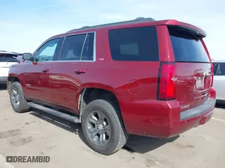 2018 Chevrolet Tahoe LT with VIN 1GNSKBKC0JR213007, listed as a IAAI auction lot 41613263 with 137,537 mi miles. Bid and sale history available at carsss.com. Image 3.