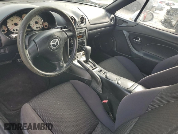 2003 Mazda MX-5 Miata Cloth z VIN JM1NB353630305964, wystawiony jako Copart lot #58517505 z przebiegiem 129 675 mil mil oraz Szkoda całkowita • Salvage title. Historia ofert i sprzedaży dostępna na DreamBid. Obrazek 8.
