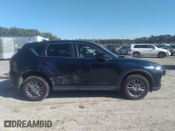 2020 Mazda CX-5 Touring with VIN JM3KFACM1L1817303, listed as a IAAI auction lot 41627859 with 57,268 mi miles. Bid and sale history available at carsss.com. Image 13.