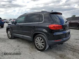 2014 Volkswagen Tiguan SE with VIN WVGAV3AXXEW543245, listed as a Copart auction lot 42288905 with 92,851 mi miles and Salvage title. Bid and sale history available at DreamBid. Image 2.