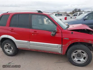 2004 Suzuki Grand Vitara with VIN JS3TE62V344100216, listed as a IAAI auction lot 41734638 with 213,166 mi miles. Bid and sale history available at carsss.com. Image 14.