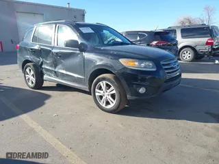2012 Hyundai Santa Fe SE with VIN 5XYZHDAG4CG097978, listed as a IAAI auction lot 41663099 with 157,882 mi miles. Bid and sale history available at carsss.com. Image 1.