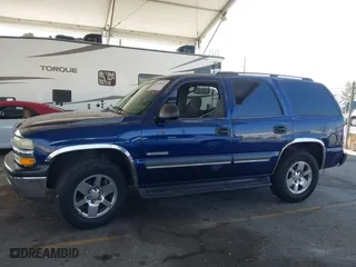 2003 Chevrolet Tahoe LT with VIN 1GNEC13T03J180708, listed as a IAAI auction lot 41543671 with 203,442 mi miles. Bid and sale history available at carsss.com. Image 6.