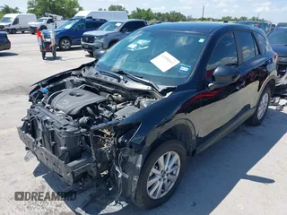 2014 Mazda CX-5 Sport with VIN JM3KE2BE9E0402015, listed as a IAAI auction lot 42098197 with 65,328 mi miles and . Bid and sale history available at carsss.com. Image 2.