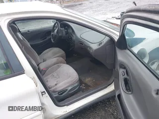 1999 Ford Taurus SE z VIN 1FAFP53U5XA269767, wystawiony jako IAAI lot #41504302 z przebiegiem 182 198 mil mil oraz . Historia ofert i sprzedaży dostępna na DreamBid. Obrazek 5.