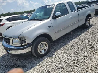 1997 Ford F-150 with VIN 1FTDX1761VNB21255, listed as a Copart auction lot 61742135 with 101,895 mi miles and Salvage title. Bid and sale history available at DreamBid. Image 1.