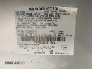 2013 Ford Taurus SEL with VIN 1FAHP2E83DG111766, listed as a IAAI auction lot 42041504 with 158,468 mi miles. Bid and sale history available at carsss.com. Image 9.
