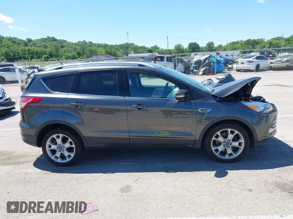 2015 Ford Escape Titanium z VIN 1FMCU9J92FUB01007, wystawiony jako IAAI lot #42319246 z przebiegiem 90 782 mil mil oraz . Historia ofert i sprzedaży dostępna na DreamBid. Obrazek 14.
