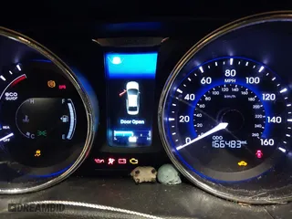 2013 Hyundai Sonata Hybrid Limited with VIN KMHEC4A44DA072580, listed as a IAAI auction lot 41489951 with 166,483 mi miles. Bid and sale history available at carsss.com. Image 7.