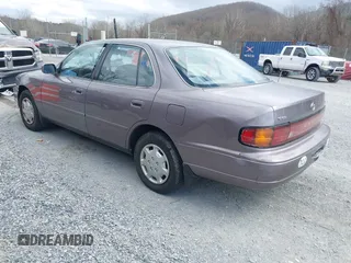 1994 Toyota Camry LE z VIN 4T1SK12E0RU463582, wystawiony jako IAAI lot #41823733 z przebiegiem 120 050 mil mil oraz . Historia ofert i sprzedaży dostępna na DreamBid. Obrazek 3.