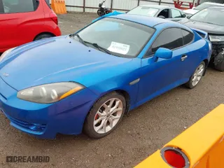 2008 Hyundai Tiburon GT with VIN KMHHN66FX8U282926, listed as a IAAI auction lot 41959023 with 119,414 mi miles. Bid and sale history available at carsss.com. Image 2.