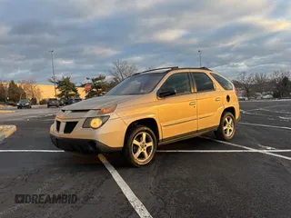 2002 Pontiac Aztek z VIN 3G7DB03E02S561022, wystawiony jako Copart lot #89014985 z przebiegiem 153 845 mil mil oraz Czysty tytuł • Clean title. Historia ofert i sprzedaży dostępna na DreamBid. Obrazek 2.