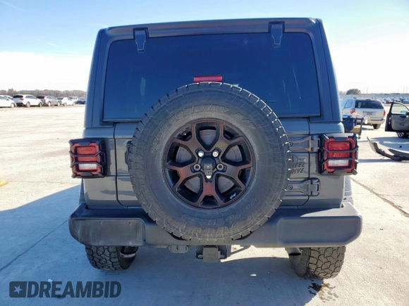 2021 Jeep Wrangler Unlimited Sport S with VIN 1C4HJXDG4MW699376, listed as a Copart auction lot 47202615 with 57,192 mi miles and Salvage Title. Bid and sale history available at DreamBid. Image 6.