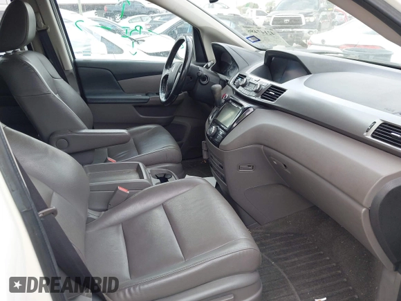 2015 Honda Odyssey EX-L z VIN 5FNRL5H60FB102770, wystawiony jako IAAI lot #42147486 z przebiegiem 160 958 mil mil oraz . Historia ofert i sprzedaży dostępna na DreamBid. Obrazek 5.