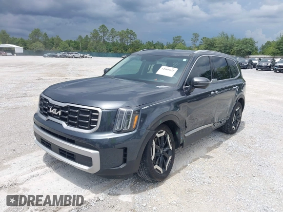2023 Kia Telluride S with VIN 5XYP64GC0PG386895, listed as a IAAI auction lot 42365625 with 41,588 mi miles and . Bid and sale history available at DreamBid. Image 2.