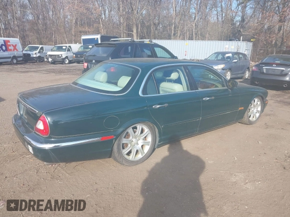 2004 Jaguar XJ with VIN SAJWA71C74SG22814, listed as a IAAI auction lot 41649399 with 114,841 mi miles. Bid and sale history available at carsss.com. Image 4.