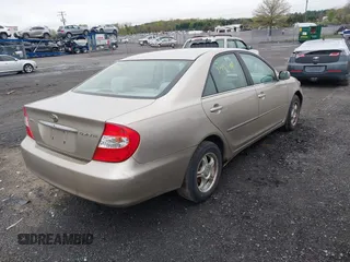 2004 Toyota Camry LE with VIN 4T1BE30KX4U327013, listed as a IAAI auction lot 41987105 with 241,236 mi miles. Bid and sale history available at carsss.com. Image 4.