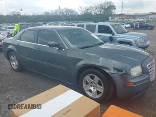 2005 Chrysler 300 with VIN 2C3AA53G55H186617, listed as a IAAI auction lot 42004943 with 230,956 mi miles. Bid and sale history available at carsss.com. Image 1.