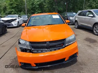 2014 Dodge Avenger SXT with VIN 1C3CDZCB7EN237635, listed as a IAAI auction lot 42521196 with 126,879 mi miles and . Bid and sale history available at DreamBid. Image 12.