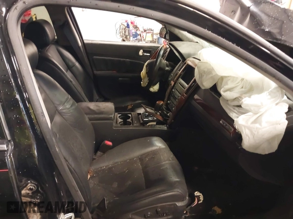 2005 Cadillac STS z VIN 1G6DW677450147731, wystawiony jako IAAI lot #40770047 z przebiegiem 150 066 mil mil oraz . Historia ofert i sprzedaży dostępna na DreamBid. Obrazek 5.