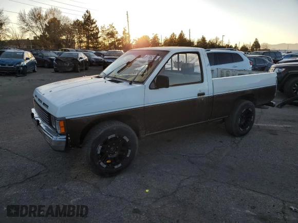 1987 Nissan Hardbody E z VIN JN6ND11S4HW011430, wystawiony jako Copart lot #81785214 z przebiegiem 334 566 mil mil oraz Tytuł czysty. Historia ofert i sprzedaży dostępna na DreamBid. Obrazek 1.